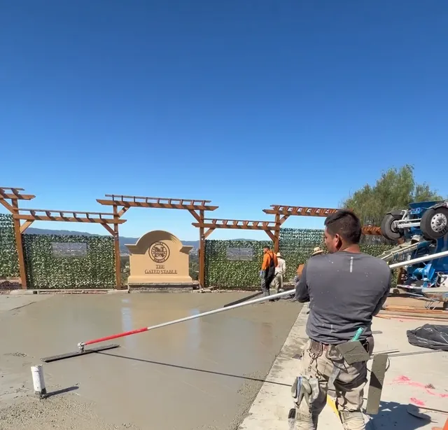 Bull floating a fresh concrete slab
